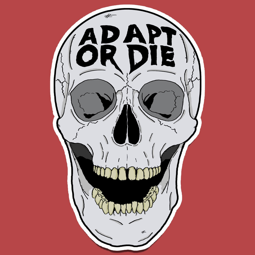 Sticker of A skull with the words 'Adapt or Die' carved into the forehead