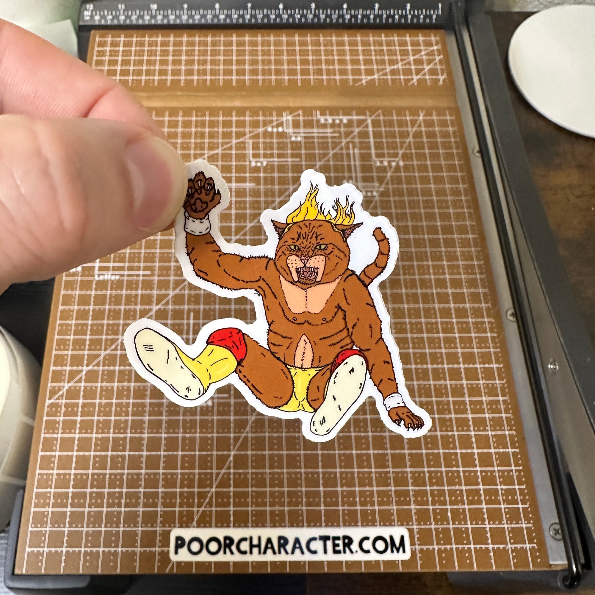 Sticker of The Catamaniac performing a Hulk Hogan-style leg drop