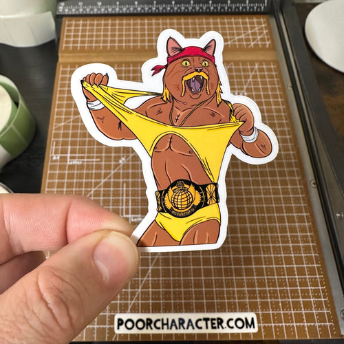 Sticker of An 80s-era pro wrestling cat tearing his t-shirt off his body and wearing the heavyweight title