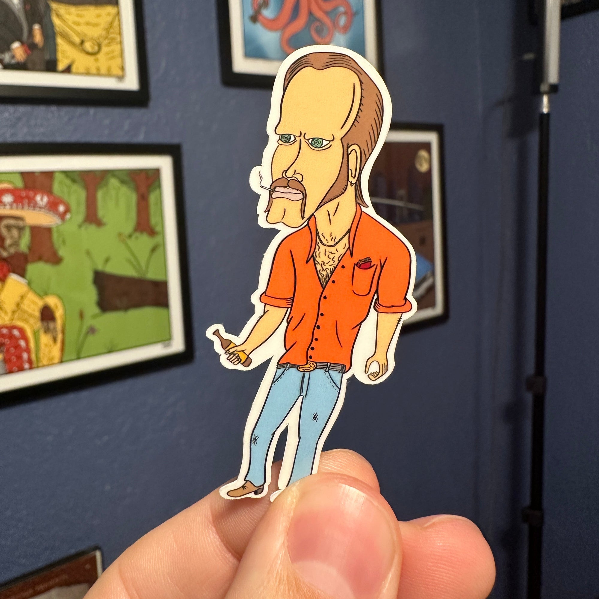 Sticker of A redneck with hypnotic eyes, mullet, beer, and cigarettes in his pocket