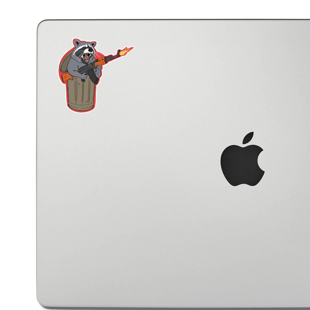 Sticker of a raccoon popping out of a trashcan while shooting an AK-47, drawn in a cartoonishly wild and rebellious style.