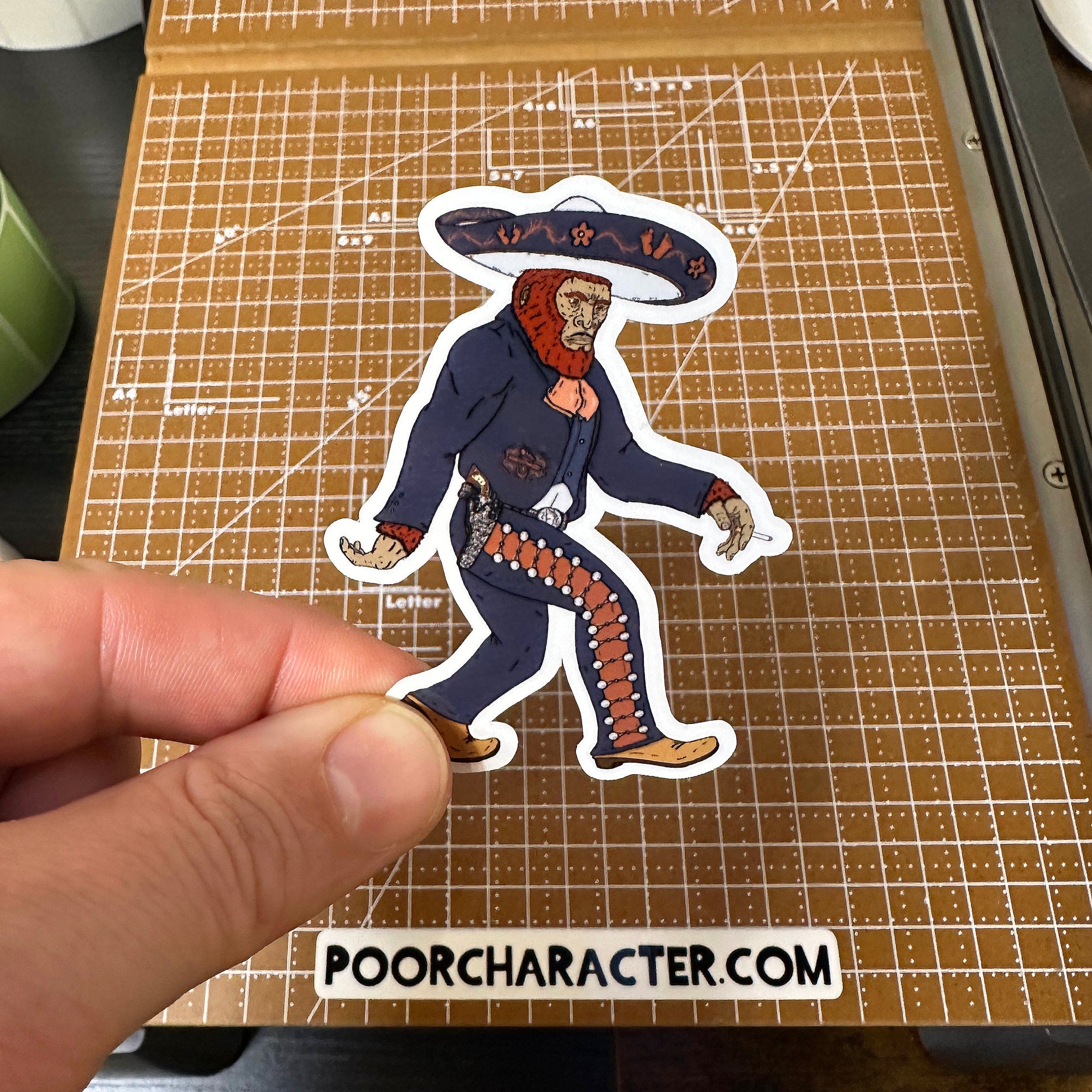 Sticker of A Bigfoot in traditional Mexican Charro gear striking the classic Bigfoot walking pose