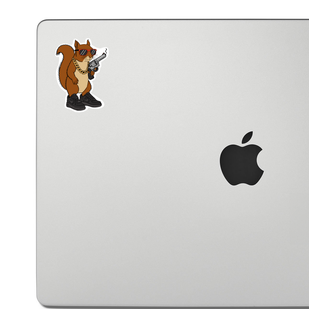 Laptop with a sticker of a cartoon squirrel holding a gun on a white background